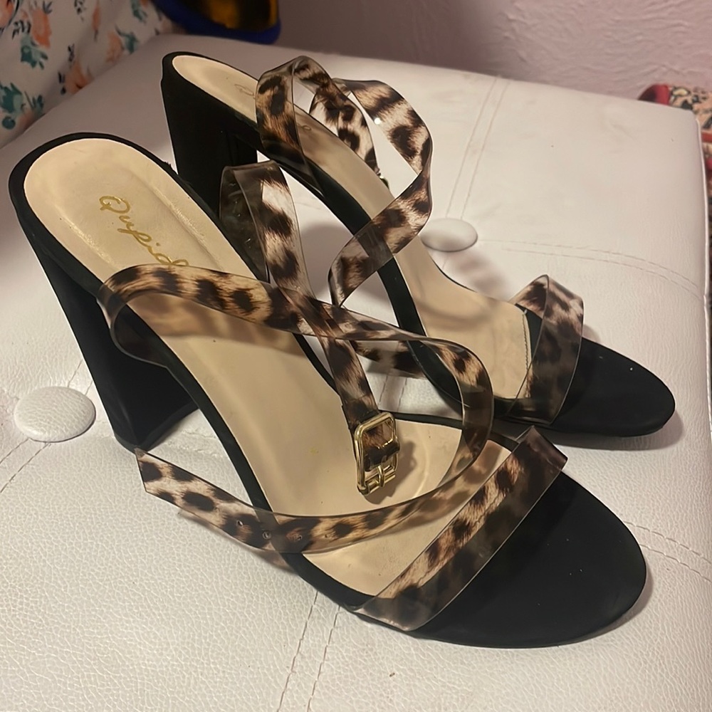 Black heels with leopard print straps